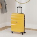 American Tourister Walizka twarda średnia żółta SPINNER 66/24 61 l